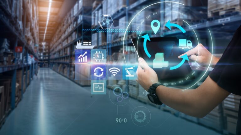 Warehouse worker using a tablet in a warehouse aisle