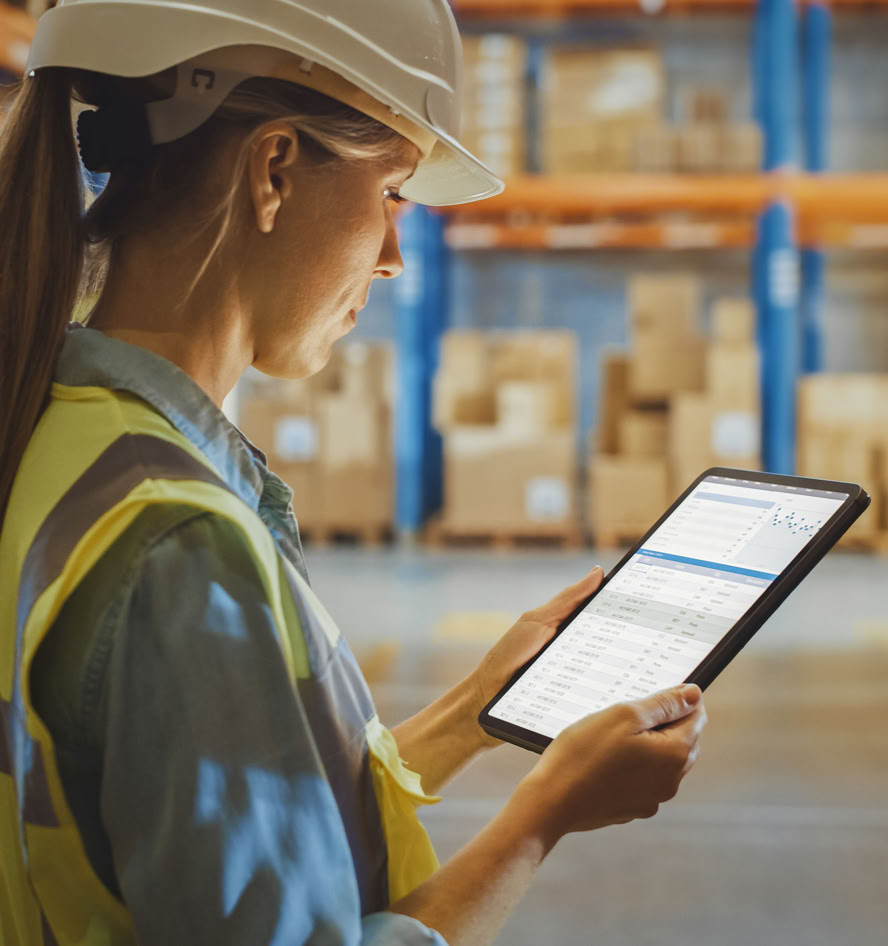 Warehouse associate using a tablet