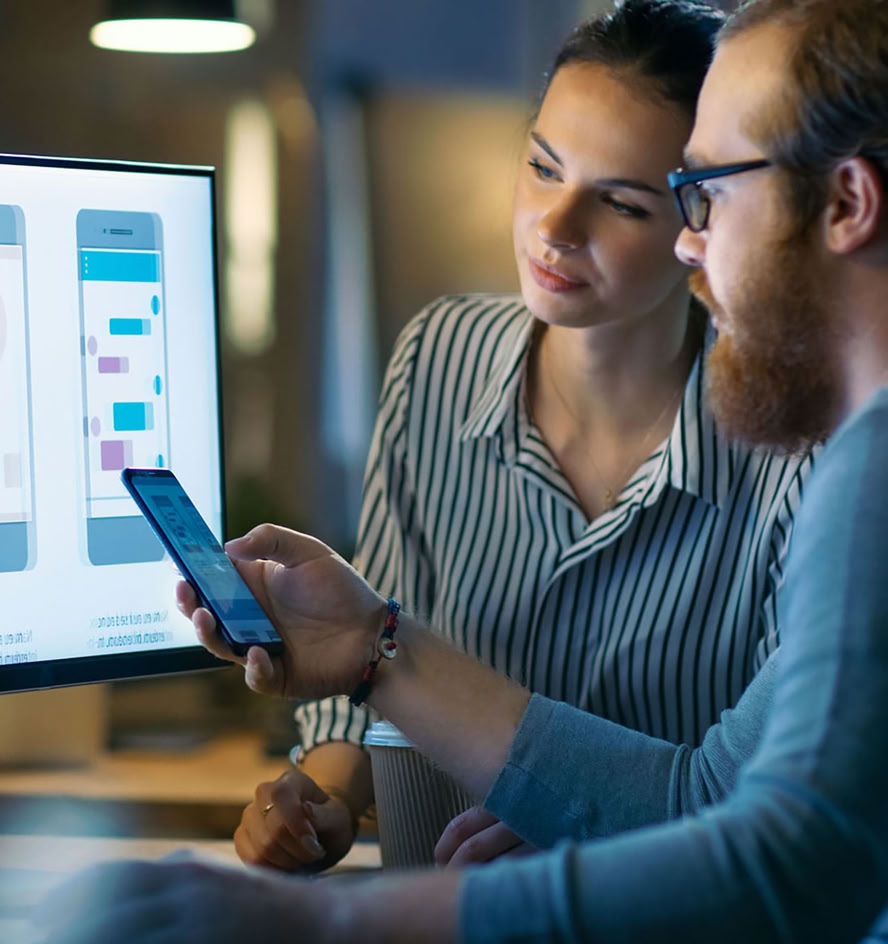 Two people reviewing warehouse workflows